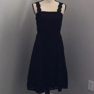 LACE STRAP EYELET FLARE DRESS IN BLACK.